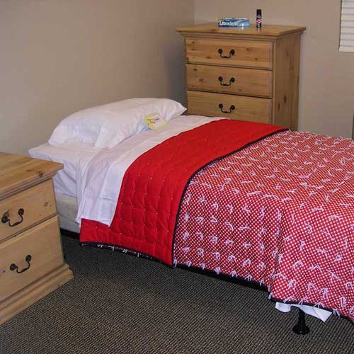 Furnished private bedroom in the Transitional Housing Program at Food & Care Coalition